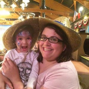 Mother holding child looking happy