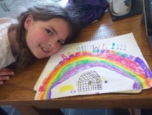 Children paint a rainbow