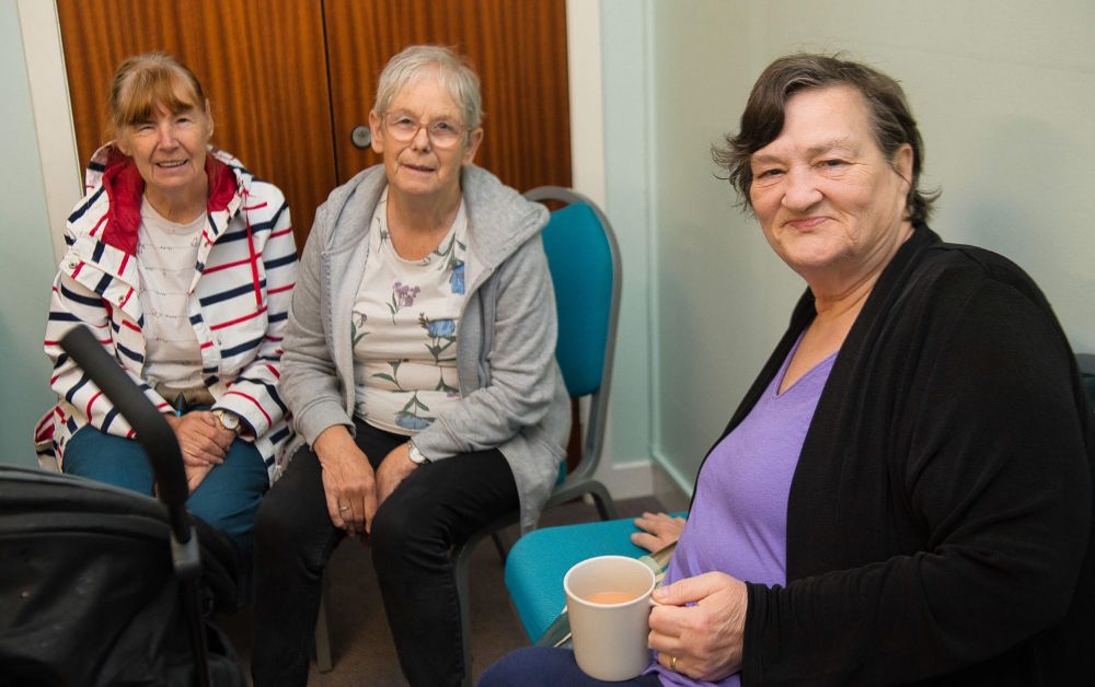 Group of women chatting together and sharing experiences