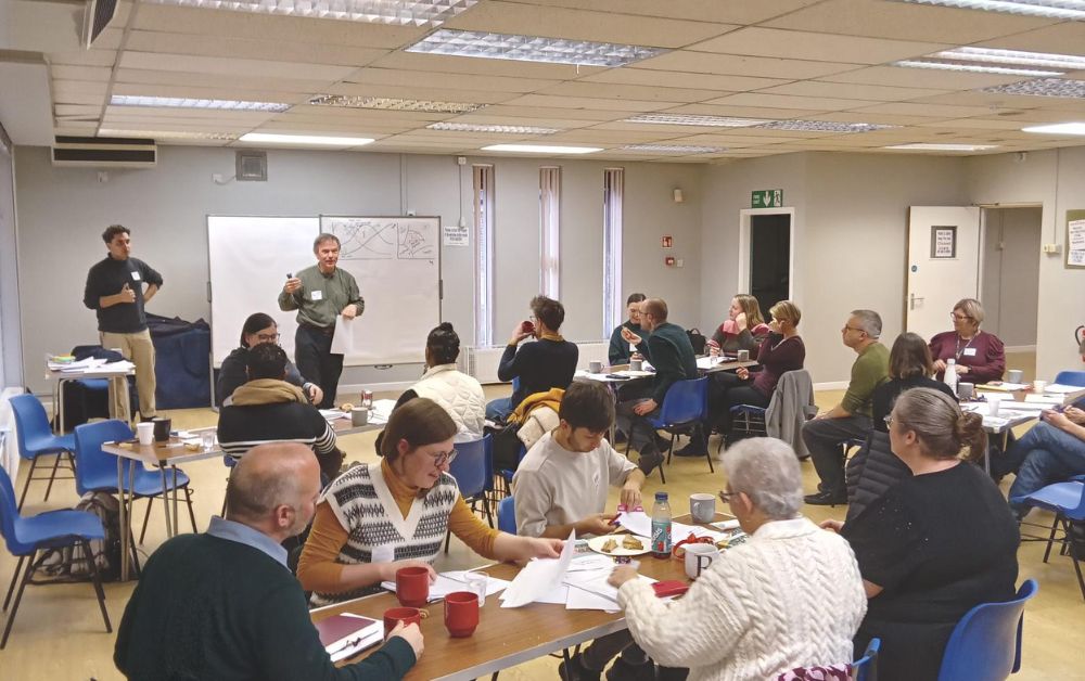 group of people chatting at multiple tables