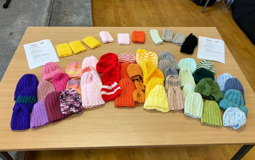 Craft cafe makes knitted baby hats